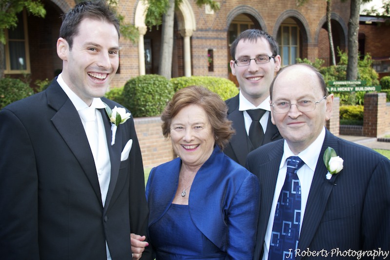 Groom laughing with his family - wedding photography sydney